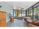 Bright sun room featuring tile floors, comfortable seating, and lots of natural light at 9466 127Th Ave, Largo, FL 33773