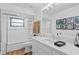 Bathroom with shower-tub combo, white subway tile, and modern vanity at 10101 Tarpon Springs Rd, Odessa, FL 33556