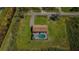 Aerial view of home showcasing screened pool and large lot surrounded by green space at 10603 1St St, Riverview, FL 33569