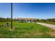 Cozy one-story home with a green lawn, a paved driveway, and a simple, attractive exterior at 10603 1St St, Riverview, FL 33569
