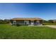 Charming one-story home featuring a well-maintained lawn and a classic, welcoming exterior at 10603 1St St, Riverview, FL 33569