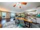 Open living space featuring a dining area that connects the living room, kitchen, and outdoor access at 10603 1St St, Riverview, FL 33569