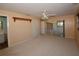 Bedroom featuring neutral carpet, ceiling fan, and convenient access to the bathroom and closet at 1108 Live Oak Ct, Clearwater, FL 33756