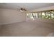 Expansive living room filled with natural light and ceiling fans at 1108 Live Oak Ct, Clearwater, FL 33756