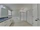 Bright bathroom featuring double vanity, shower, tub, and neutral tones at 11319 Clayridge Dr, Tampa, FL 33635