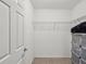 Walk-in closet with ample shelving and storage solutions at 11641 Crowned Sparrow Ln, Tampa, FL 33626