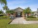 Inviting clubhouse entrance with well-manicured landscaping, offering community amenities at 11641 Crowned Sparrow Ln, Tampa, FL 33626