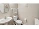 A half bathroom with nice pedestal sink at 11641 Crowned Sparrow Ln, Tampa, FL 33626