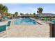 Community pool with lounge chairs, tables, and covered pavilion for residents at 11641 Crowned Sparrow Ln, Tampa, FL 33626