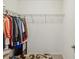 Well-organized walk-in closet with shelving and hanging space, offering efficient storage solutions at 11641 Crowned Sparrow Ln, Tampa, FL 33626