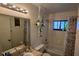 Clean bathroom with combined shower and tub, adorned with plants and a large mirror at 11711 Raintree Village Blvd # C, Temple Terrace, FL 33617