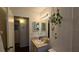 Cozy bathroom featuring a vanity with a mirror, soft lighting, and simple decor at 11711 Raintree Village Blvd # C, Temple Terrace, FL 33617
