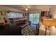 Bright bedroom with bunk beds, large windows, and playful decor at 11711 Raintree Village Blvd # C, Temple Terrace, FL 33617