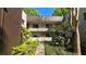 Apartment building exterior showcases a community with green spaces and easy access to units at 11711 Raintree Village Blvd # C, Temple Terrace, FL 33617