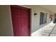A private entry door, exterior sconce lighting, and a secure entrance at 11711 Raintree Village Blvd # C, Temple Terrace, FL 33617