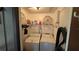 Functional laundry room features a washer, dryer, shelving and some bike tires at 11711 Raintree Village Blvd # C, Temple Terrace, FL 33617