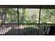 A view from the screened porch overlooking a lush green yard at 11711 Raintree Village Blvd # C, Temple Terrace, FL 33617