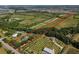 An aerial showing of the property with lush surroundings, homes, and distinct boundary lines at 11716 Cr 672 Hwy, Riverview, FL 33579