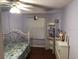 Cozy bedroom with ample space, a ceiling fan, and a large window for natural light at 11716 Cr 672 Hwy, Riverview, FL 33579
