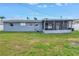 Spacious backyard featuring a screened-in porch and complete fencing at 11973 80Th Ave, Seminole, FL 33772