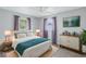 Bright bedroom features a ceiling fan, wood-look floors, and neutral paint at 11973 80Th Ave, Seminole, FL 33772