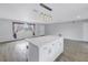 Open floor plan featuring a large kitchen island with pendant lights and seating at 11973 80Th Ave, Seminole, FL 33772