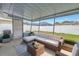 Covered patio featuring a comfortable seating area for outdoor relaxation at 11973 80Th Ave, Seminole, FL 33772