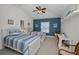 Comfortable bedroom with two beds, a desk area, ceiling fan, and coastal-themed decor at 13207 San Blas Loop, Largo, FL 33774