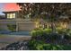 Lovely townhome with a two-car garage, pretty landscaping, and a welcoming front entrance at 13207 San Blas Loop, Largo, FL 33774