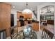 Kitchen featuring wooden cabinets, black appliances and an adjoining living room and stairway at 13207 San Blas Loop, Largo, FL 33774