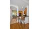Inviting kitchen bar with granite counters, wooden cabinets and adjoining breakfast nook with bright natural light at 13207 San Blas Loop, Largo, FL 33774