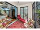 Spacious lanai featuring comfortable lounge chairs and screened windows with beautiful views at 13207 San Blas Loop, Largo, FL 33774