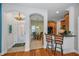 Beautiful entryway to home with tile floors leading to kitchen and dining room at 13207 San Blas Loop, Largo, FL 33774