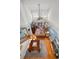 View from above of the living room, showcasing natural lighting and comfortable furnishings with hardwood floors at 13207 San Blas Loop, Largo, FL 33774