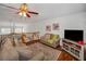 Comfortable loft area features plush seating, hardwood floors and view overlooking the living area below at 13207 San Blas Loop, Largo, FL 33774