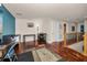 Loft area with hardwood floors and a view of the area below, perfect for an office or reading nook at 13207 San Blas Loop, Largo, FL 33774