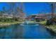 Scenic pond view with a fountain and landscaped surroundings, adding to the property's charm at 13207 San Blas Loop, Largo, FL 33774