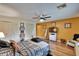 Comfortable bedroom showcasing wood floors, ceiling fan, and ample closet space at 1426 Ingram Dr # 1426, Sun City Center, FL 33573