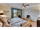 Cozy bedroom featuring ample natural light, closet space, and comfortable seating at 1426 Ingram Dr # 1426, Sun City Center, FL 33573