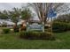 Entrance sign to Idlewood community with landscaped surroundings and street signs at 1426 Ingram Dr # 1426, Sun City Center, FL 33573