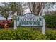 Entrance sign to Idlewood community with lush landscaping and charming decorations at 1426 Ingram Dr # 1426, Sun City Center, FL 33573