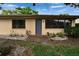Charming home exterior with a simple walkway, well-placed windows, and tidy landscaping at 1426 Ingram Dr # 1426, Sun City Center, FL 33573