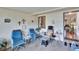 Relaxing covered front porch featuring comfortable seating and a charming, welcoming atmosphere at 1426 Ingram Dr # 1426, Sun City Center, FL 33573