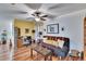 Versatile home office area with a ceiling fan, desk, and stylish decor, offering a quiet and productive workspace at 1426 Ingram Dr # 1426, Sun City Center, FL 33573
