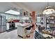 Bright kitchen featuring modern appliances, a breakfast bar, and a view to the patio, perfect for cooking and dining at 1426 Ingram Dr # 1426, Sun City Center, FL 33573