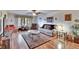 Well-lit living room with wood floors, a ceiling fan, and tastefully arranged furniture, perfect for relaxation and entertainment at 1426 Ingram Dr # 1426, Sun City Center, FL 33573