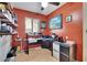Functional office space with built-in shelving, an organized desk area, and a cozy ambiance at 1426 Ingram Dr # 1426, Sun City Center, FL 33573