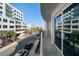 Balcony view overlooking the street, showcasing nearby buildings and neighborhood at 15 Avalon St # 303, Clearwater Beach, FL 33767