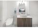 Bright bathroom featuring a modern vanity with a vessel sink and a sleek toilet at 15 Avalon St # 303, Clearwater Beach, FL 33767