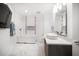 Modern bathroom with sleek fixtures, including a soaking tub and floating vanity at 15 Avalon St # 303, Clearwater Beach, FL 33767